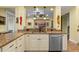 Modern kitchen with granite countertops, white cabinetry, and stainless steel appliances at 3305 Cat Brier Trl, Harmony, FL 34773