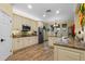 Kitchen with white cabinetry, granite countertops, and stainless steel appliances at 3305 Cat Brier Trl, Harmony, FL 34773