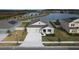 Aerial view of house with solar panels and lake view at 420 Watusi Way, St Cloud, FL 34772