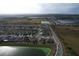 Aerial view of houses and lake in a residential area at 420 Watusi Way, St Cloud, FL 34772