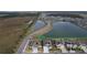Aerial view of homes and lake in a new community at 420 Watusi Way, St Cloud, FL 34772