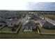 Aerial view showing community and homes with solar panels at 420 Watusi Way, St Cloud, FL 34772