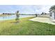 Spacious backyard with a patio overlooking a lake at 420 Watusi Way, St Cloud, FL 34772