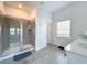 Modern bathroom with walk-in shower and updated vanity at 420 Watusi Way, St Cloud, FL 34772