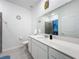 Bathroom with white vanity, shower, and toilet at 420 Watusi Way, St Cloud, FL 34772