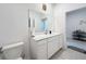 Bathroom with white vanity and toilet at 420 Watusi Way, St Cloud, FL 34772