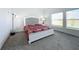Spacious bedroom with lake view and stylish furniture at 420 Watusi Way, St Cloud, FL 34772