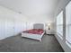 Spacious bedroom with carpeted floor and large windows at 420 Watusi Way, St Cloud, FL 34772
