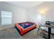 Bright bedroom with a bed, desk, and window coverings at 420 Watusi Way, St Cloud, FL 34772