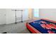 Bedroom with a bed, clothing rack, and window at 420 Watusi Way, St Cloud, FL 34772