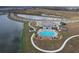 Aerial view of community pool, playground, and lake at 420 Watusi Way, St Cloud, FL 34772