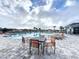 Relaxing community pool area with lounge chairs and tables at 420 Watusi Way, St Cloud, FL 34772