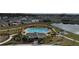Community pool with lounge chairs and a cabana at 420 Watusi Way, St Cloud, FL 34772