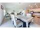 Bright dining area with table and chairs, adjacent to living room and kitchen at 420 Watusi Way, St Cloud, FL 34772