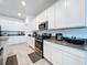 Modern kitchen with stainless steel appliances and white cabinets at 420 Watusi Way, St Cloud, FL 34772