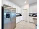 Kitchen features stainless steel refrigerator and white cabinets at 420 Watusi Way, St Cloud, FL 34772
