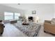 Bright living room with lake view, comfy seating, and large area rug at 420 Watusi Way, St Cloud, FL 34772