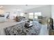Open living room with lake view and comfortable seating at 420 Watusi Way, St Cloud, FL 34772