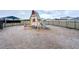 Community playground with playhouse and slide at 420 Watusi Way, St Cloud, FL 34772
