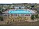 Community pool with lounge chairs and a pool house at 420 Watusi Way, St Cloud, FL 34772