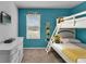 Bedroom with twin-over-twin bunk beds and Minion decor at 4735 Terrasonesta Dr, Davenport, FL 33837