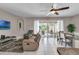 Spacious living room with access to pool and patio at 4735 Terrasonesta Dr, Davenport, FL 33837
