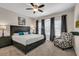 Main bedroom with king bed and sitting area at 4735 Terrasonesta Dr, Davenport, FL 33837