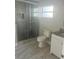 Clean bathroom with a large shower and granite vanity at 5411 Ira St, Orlando, FL 32807