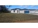 New construction home with a large grassy yard at 605 Raven Ct, Kissimmee, FL 34759