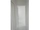 Bright hallway with white doors and marble-look floors at 605 Raven Ct, Kissimmee, FL 34759