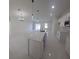 Modern kitchen with white cabinets, a large island, and marble-look flooring at 605 Raven Ct, Kissimmee, FL 34759