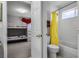 Bright bathroom includes a shower/tub combo and updated vanity at 673 Copeland Dr, Haines City, FL 33844