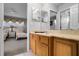 Clean bathroom with a sink, toilet, and access to bedroom at 673 Copeland Dr, Haines City, FL 33844