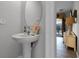 Convenient powder room with pedestal sink at 673 Copeland Dr, Haines City, FL 33844