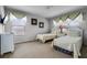 Charming bedroom with two twin beds and neutral decor at 673 Copeland Dr, Haines City, FL 33844