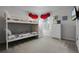 Well-lit bedroom with a bunk bed and plenty of closet space at 673 Copeland Dr, Haines City, FL 33844