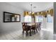 Formal dining room with wooden table and chairs, and access to backyard at 673 Copeland Dr, Haines City, FL 33844