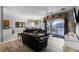 Living room with black leather sofas, access to backyard and pool at 673 Copeland Dr, Haines City, FL 33844
