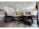 Spacious living room with black leather sofas, coffee table and large windows at 673 Copeland Dr, Haines City, FL 33844