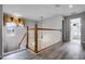 Upstairs hall with wood-like flooring and access to bedrooms and bathroom at 673 Copeland Dr, Haines City, FL 33844