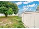 Backyard with shed, mature tree and fence at 723 Florida Pkwy, Kissimmee, FL 34743