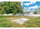 Backyard view, showing a large tree and shed at 723 Florida Pkwy, Kissimmee, FL 34743