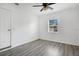 Simple bedroom with wood-look flooring at 723 Florida Pkwy, Kissimmee, FL 34743