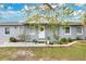 Gray house with white trim, landscaping, and a walkway at 723 Florida Pkwy, Kissimmee, FL 34743
