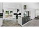 Modern kitchen with white cabinets, granite countertops, and stainless steel appliances at 723 Florida Pkwy, Kissimmee, FL 34743