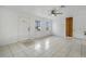 Bright living room with tile floors and a ceiling fan at 723 Florida Pkwy, Kissimmee, FL 34743