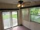 Sunroom with sliding glass doors and ceiling fan at 8286 County Road 109B, Lady Lake, FL 32159