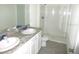 Bathroom with double vanity and shower at 1366 Yellow Finch Dr, Davenport, FL 33837
