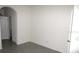 Simple bedroom with tile flooring and a door to a bathroom at 1366 Yellow Finch Dr, Davenport, FL 33837