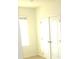 Bedroom with double doors and window at 1366 Yellow Finch Dr, Davenport, FL 33837